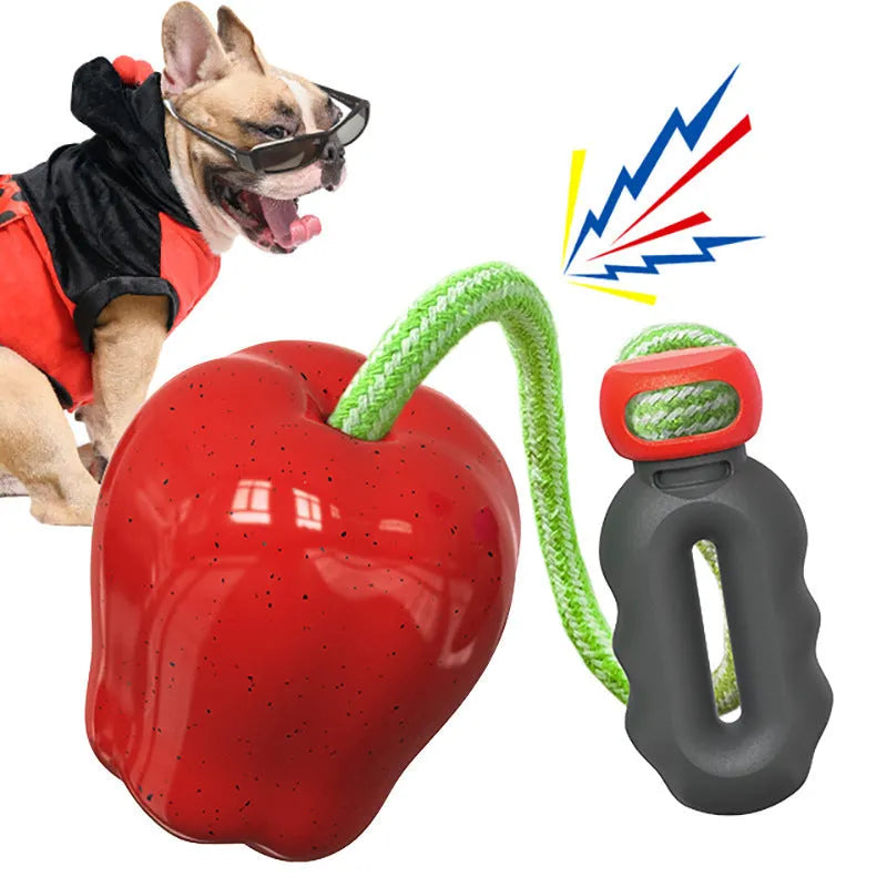 Green plastic dog dropping ball toy with squeaker for outdoor fetch and chewing