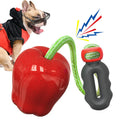 Green plastic dog dropping ball toy with squeaker for outdoor fetch and chewing