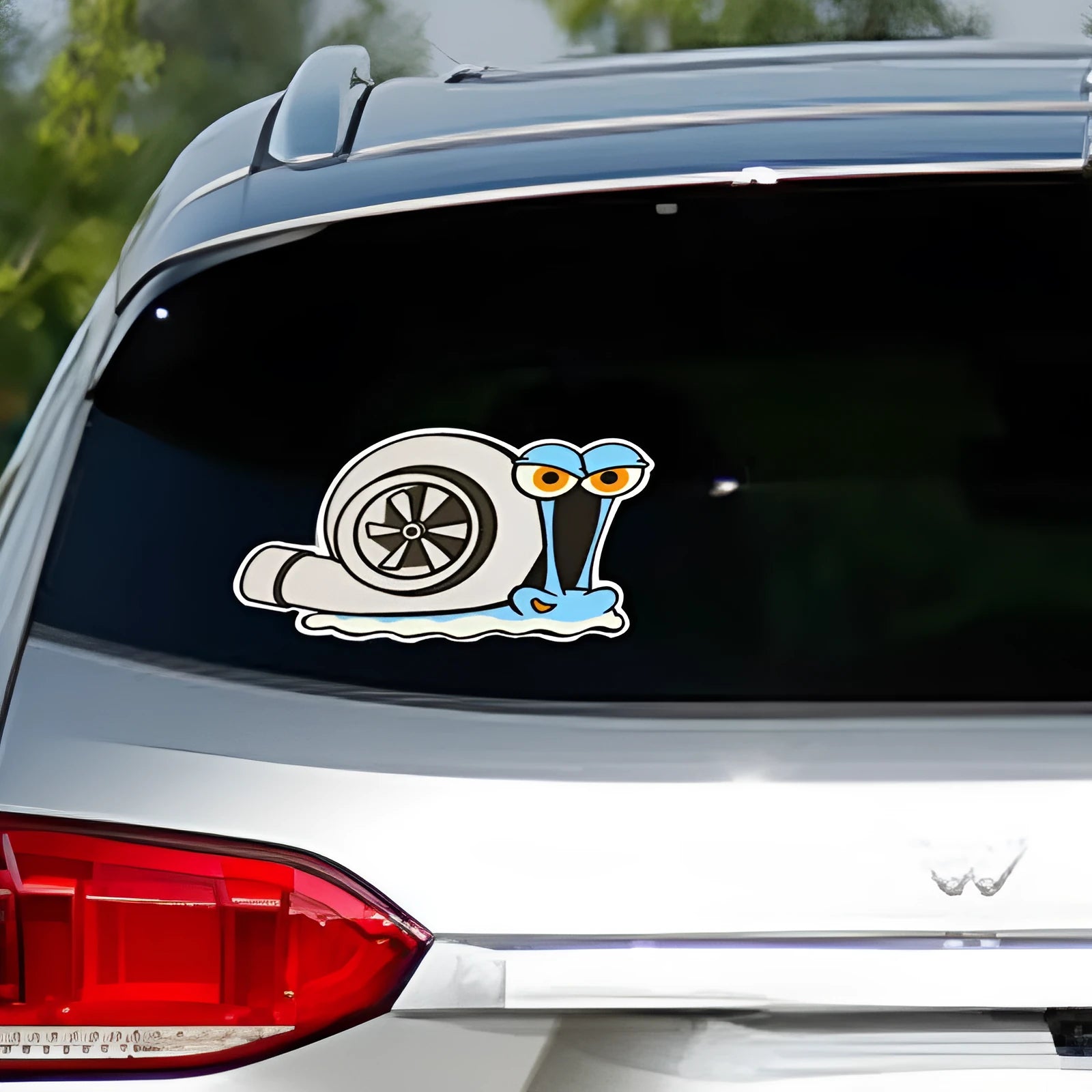 White reflective car sticker with a printed cartoon snail design, shown at 12cm by 8cm scale