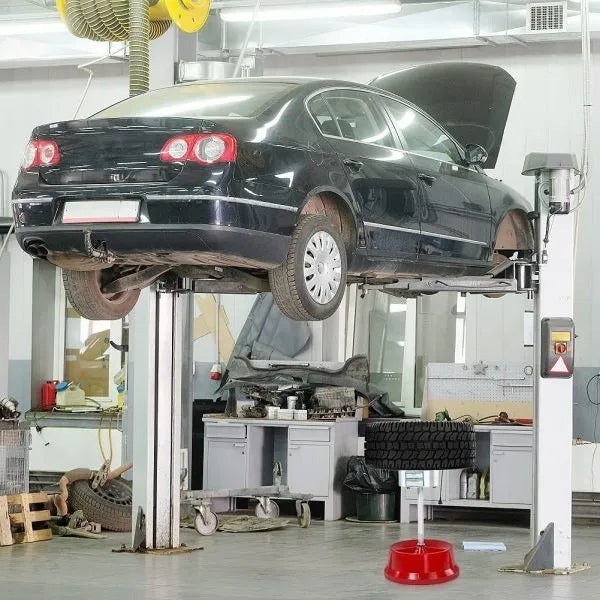 Portable aluminium head hub balancer for car and truck tyres with bull's eye level on a black enamel base.