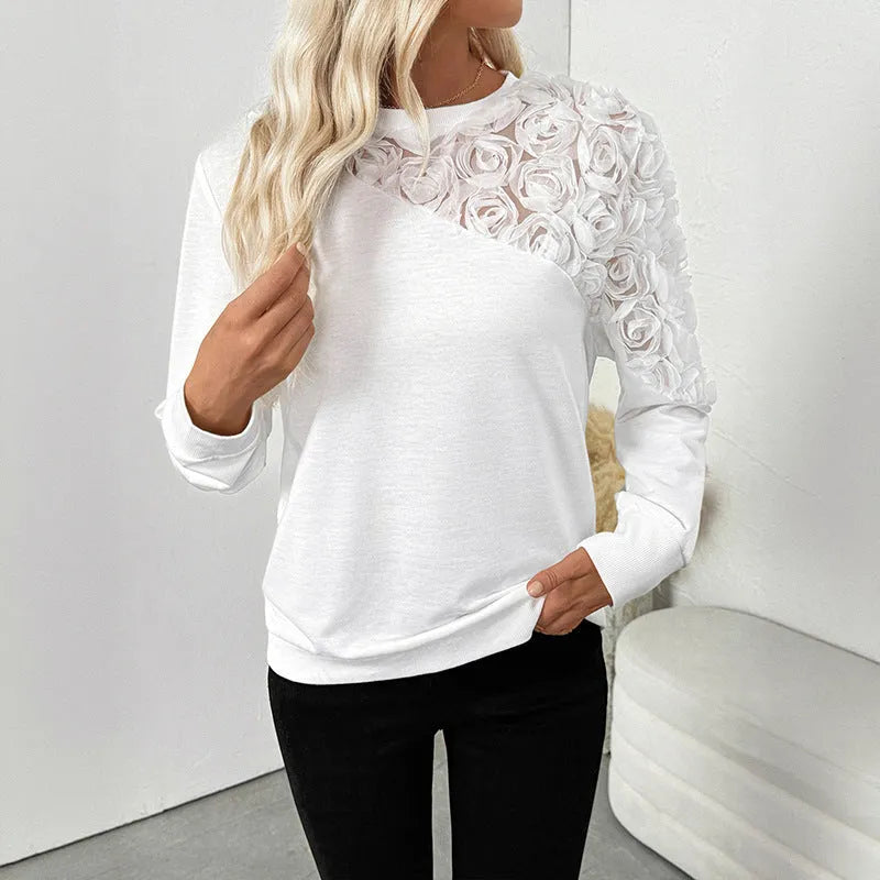 White long sleeve top with floral pattern in loose fit pullover style