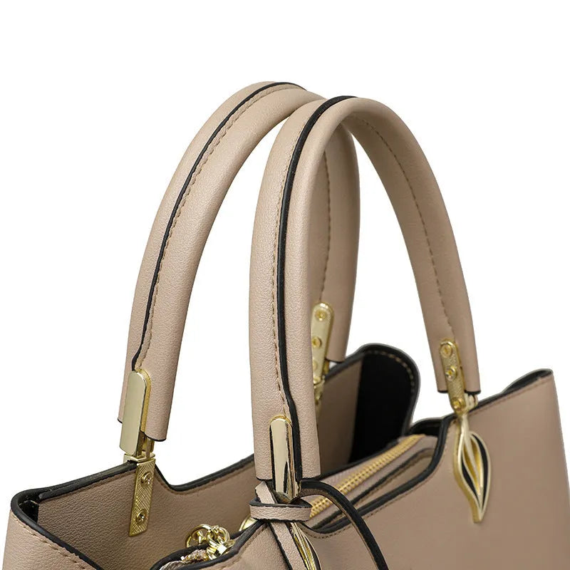 Women's black PU leather multi-compartment shoulder messenger bag with adjustable strap.