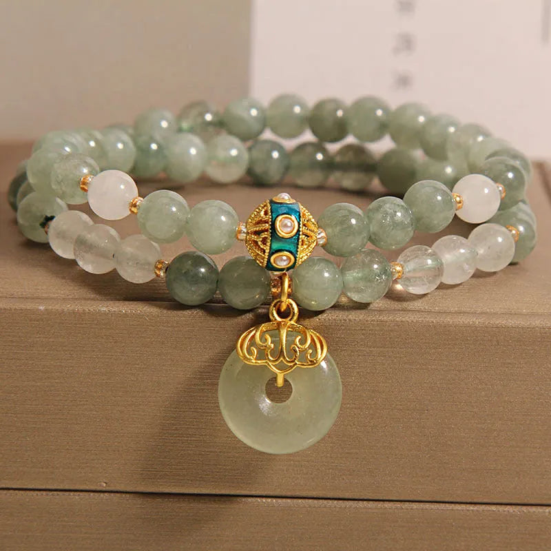 Women's double-layer aventurine jade bracelet with peace buckle closure in emerald green