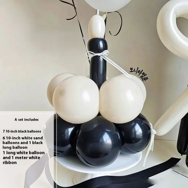 DIY balloon bouquet decoration kit with round balloons for cake toppers, showing one complete set.