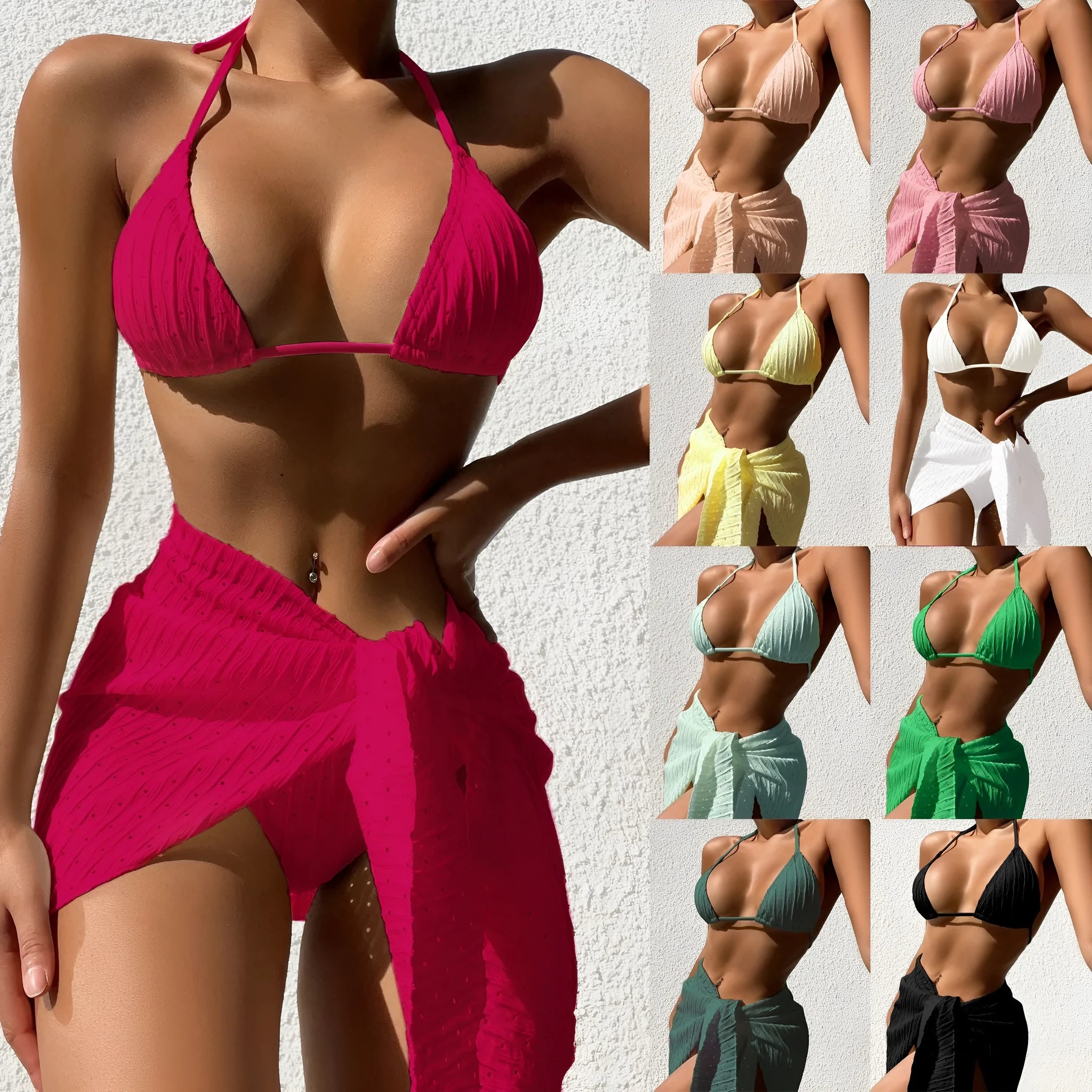 Women's solid colour halterneck bikini top and mesh skirt swimsuit set on a hanger.