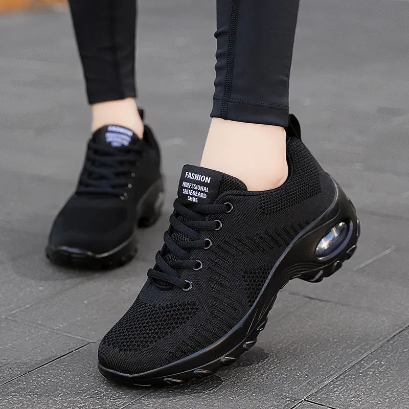 Women's red and black mesh sneakers with round toe and front lace-up design