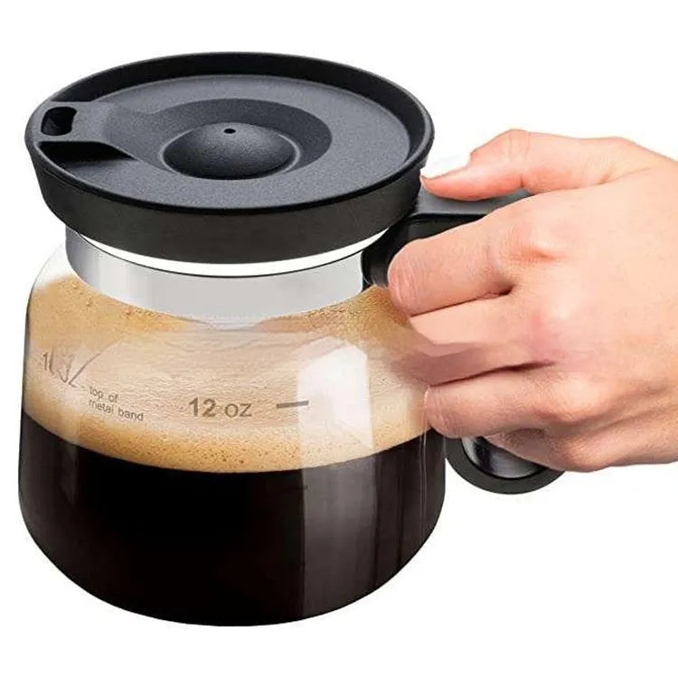Transparent borosilicate glass coffee maker with silicone cover showing modern design