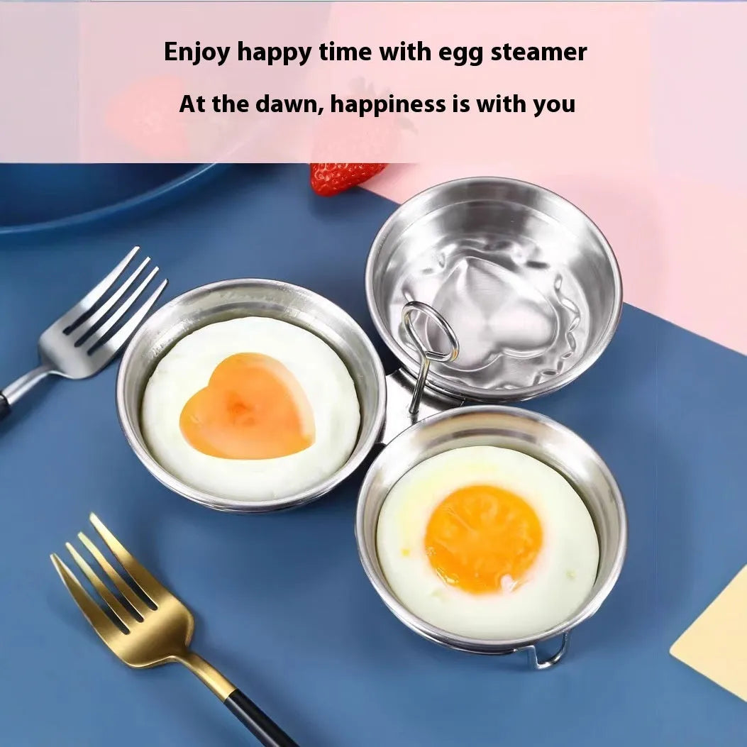 Small stainless steel heart-shaped egg steamer or cooker on a kitchen counter.
