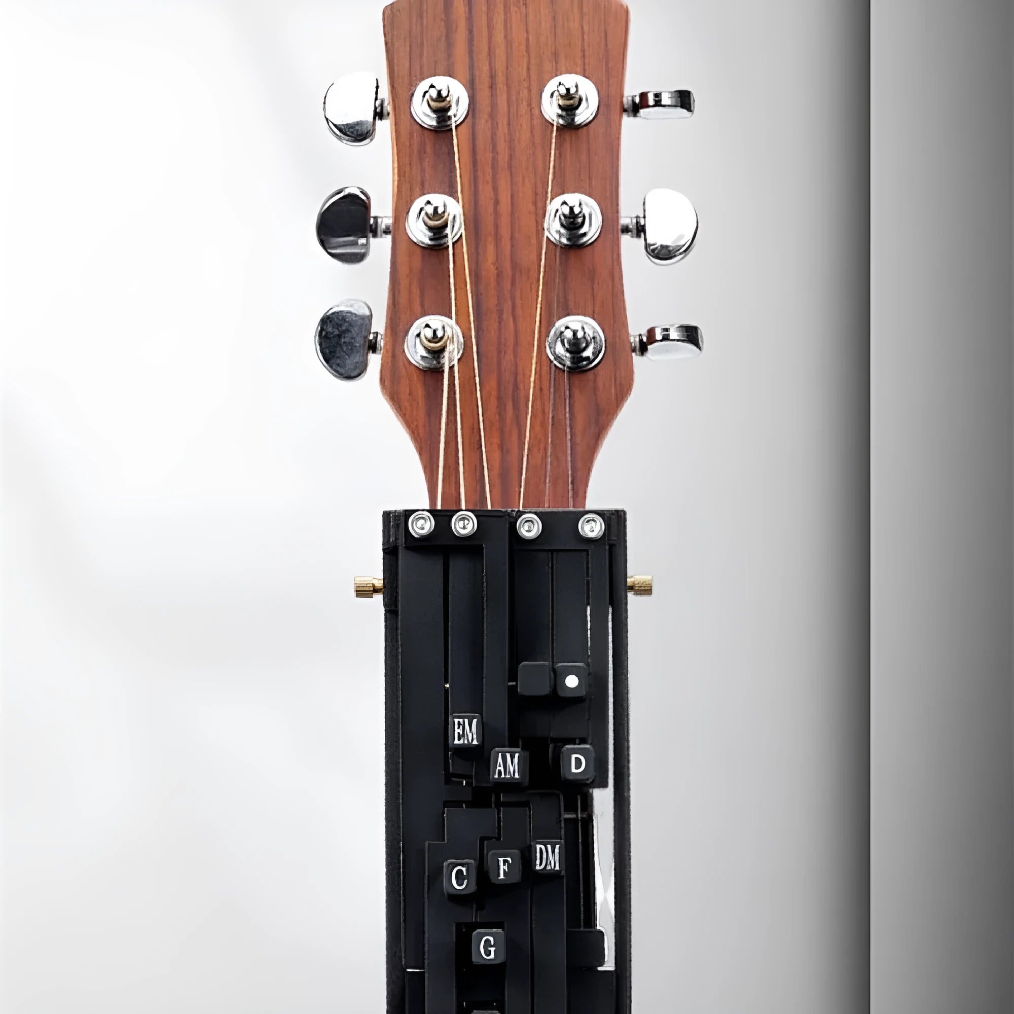 Automatic guitar chord device for beginners clamped on acoustic guitar neck