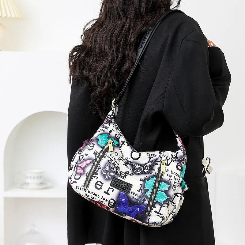 Graffiti casual crossbody bag in nylon with sewing line and print details, medium-soft build, single strap, dumpling shape