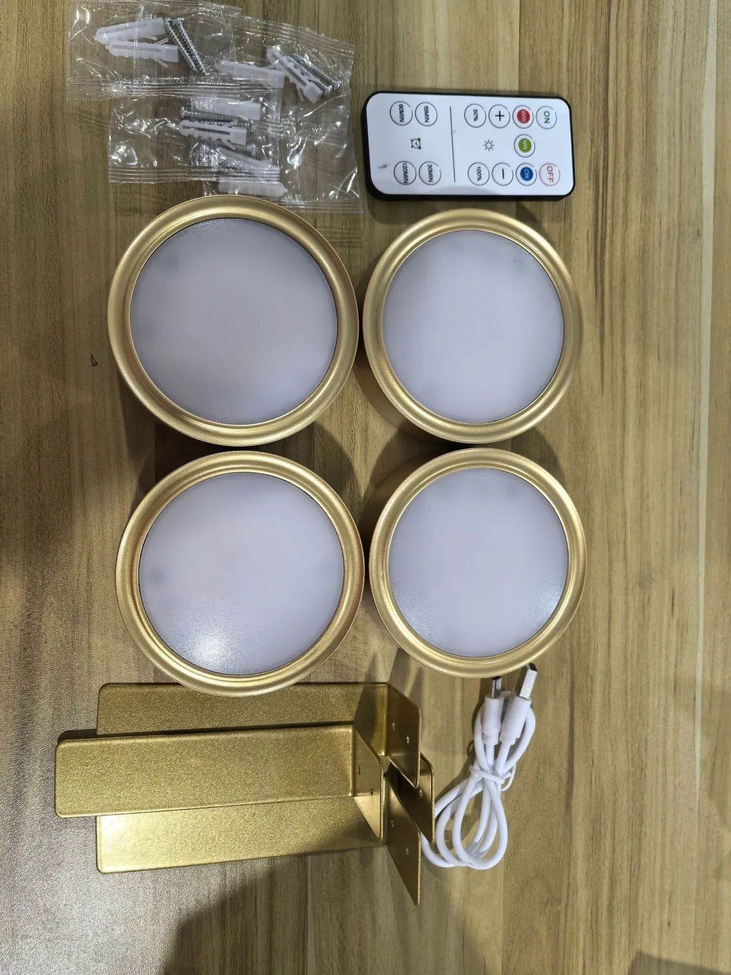 Wireless rechargeable LED painting lamp with magnetic belt attached to a metal frame, remote control nearby.