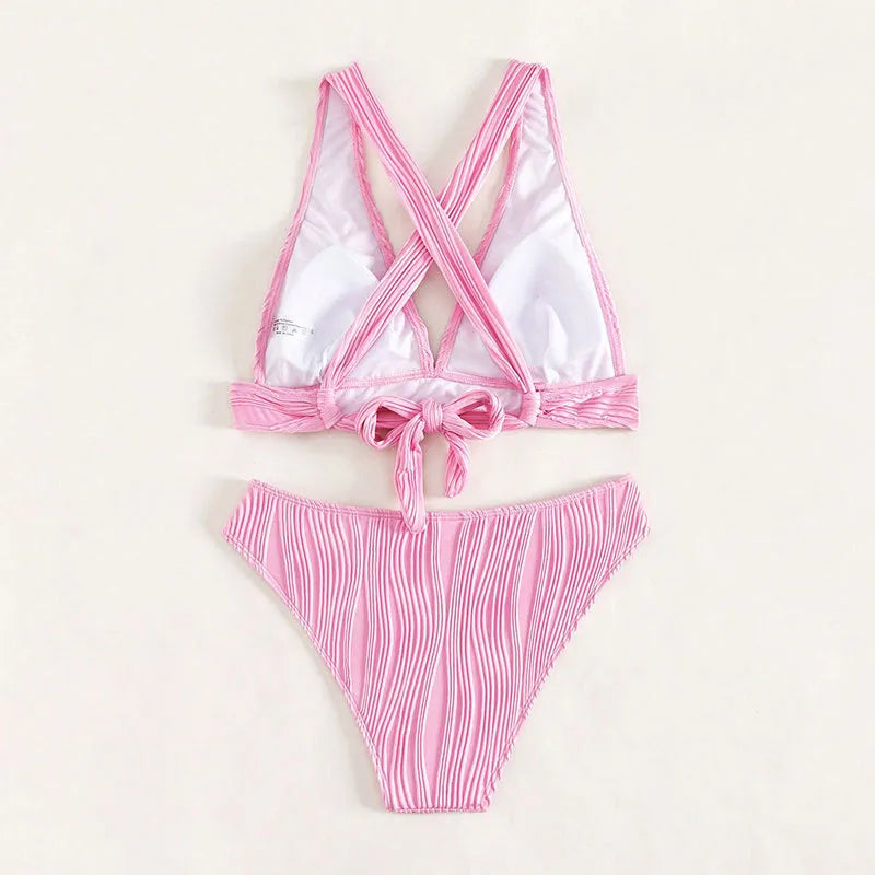 Women's pink and black halter neck bikini set with shorts, shown front and back.
