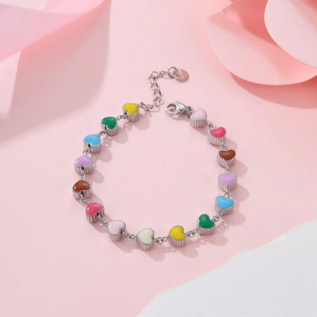 Gold or steel coloured women's bracelet with heart-shaped titanium steel pendant on stainless steel band