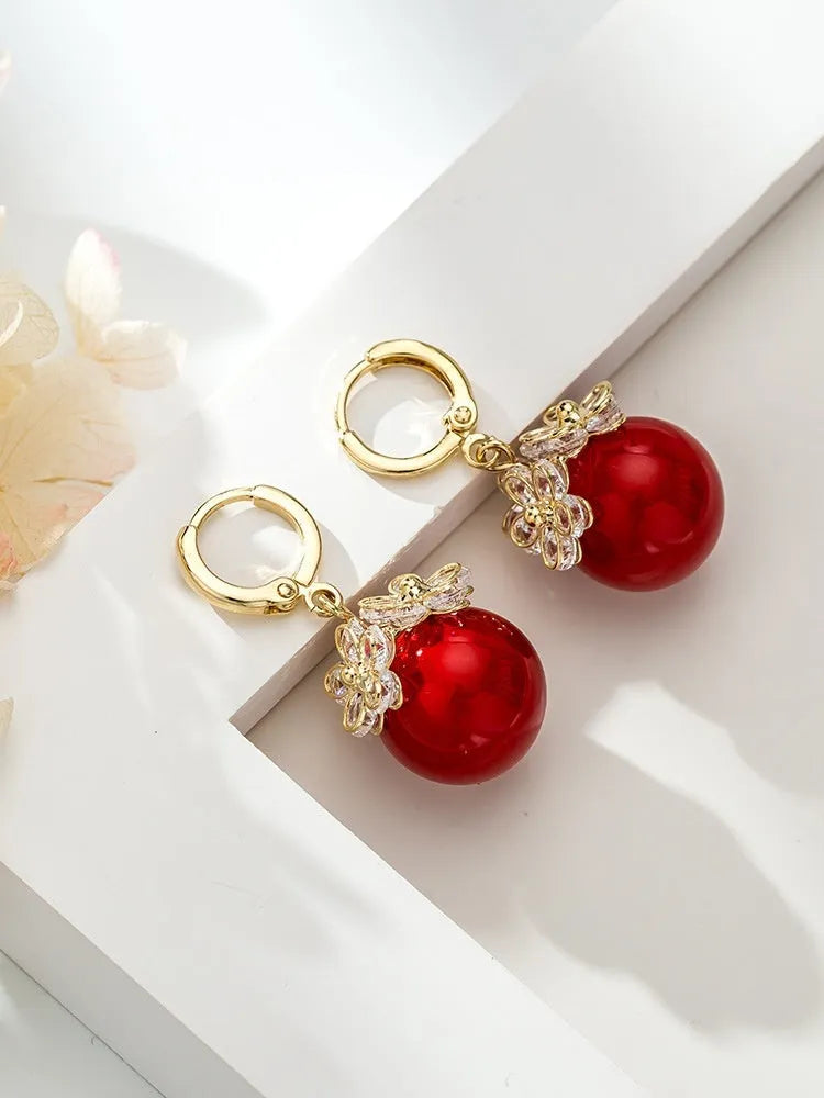 Women's geometric copper earrings with zircon and rose design elements in various colours