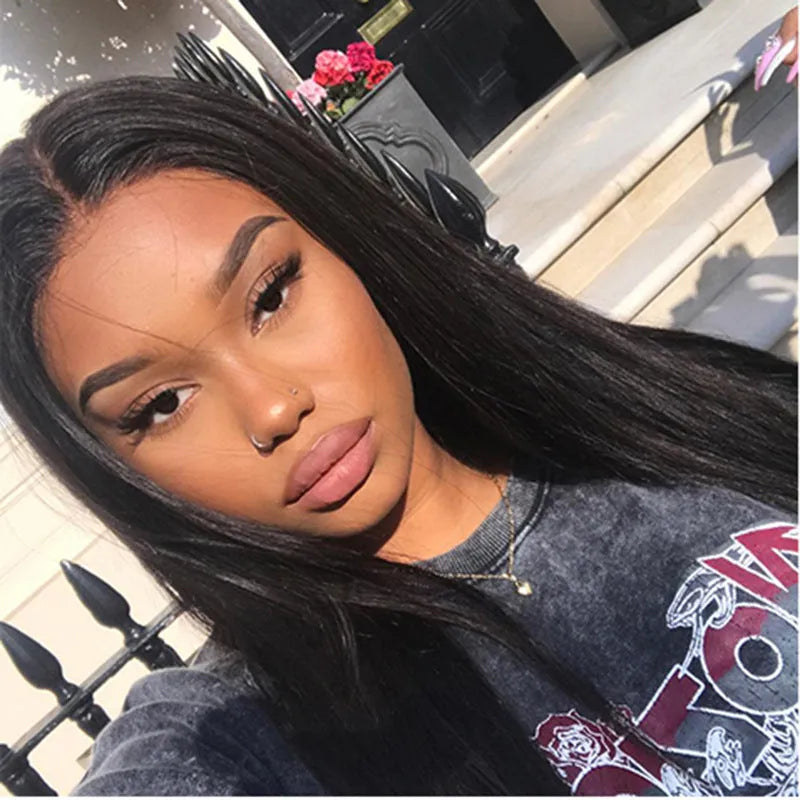 Long straight black synthetic wig with centre-parted bangs on a model.