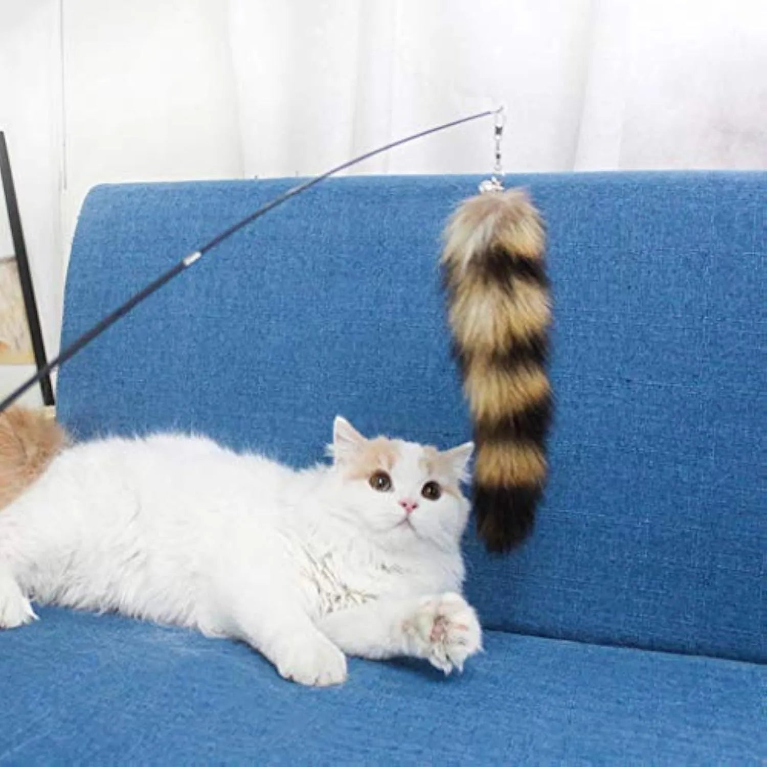 Black cat toy wand with feather teaser on elastic string measuring 42cm