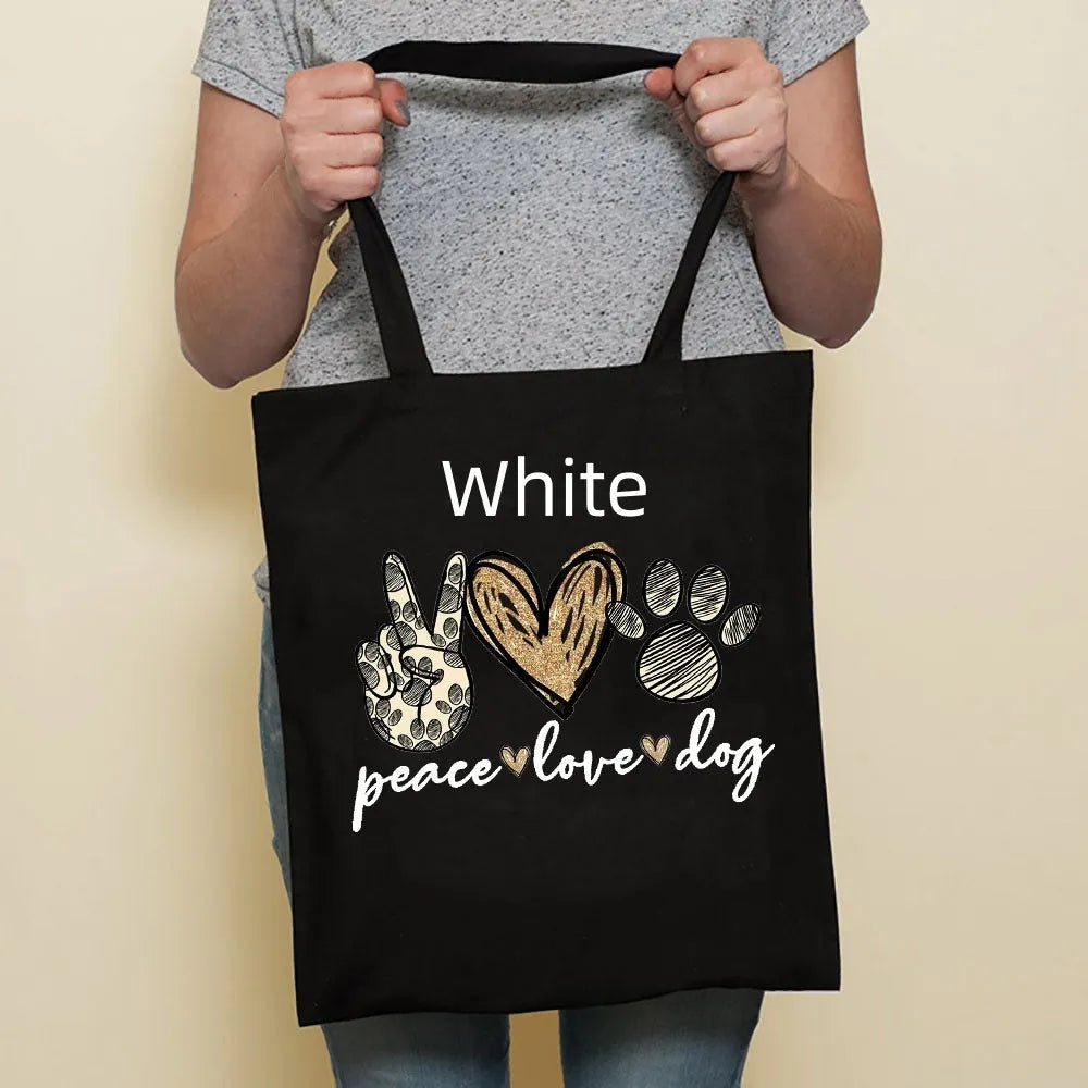 Sausage dog printed canvas bag in black with white dog design on front, sturdy tote for everyday use