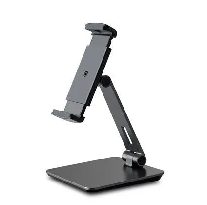 Folding aluminium desktop phone and tablet stand with 360-degree rotation on a wooden desk.