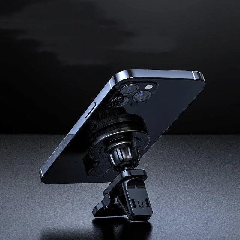 Black and white magnetic wireless charger on a desk with phone