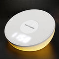 White 10W wireless charging pad with digital clock display and three control buttons.