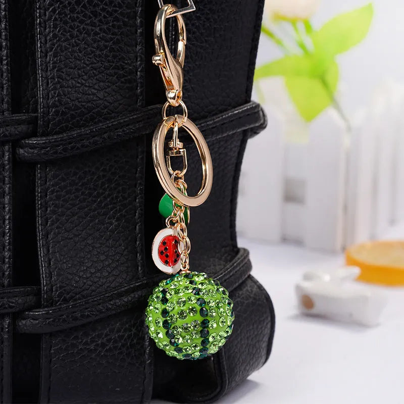 Green watermelon fruit keychain made from zinc alloy measuring 12cm in length