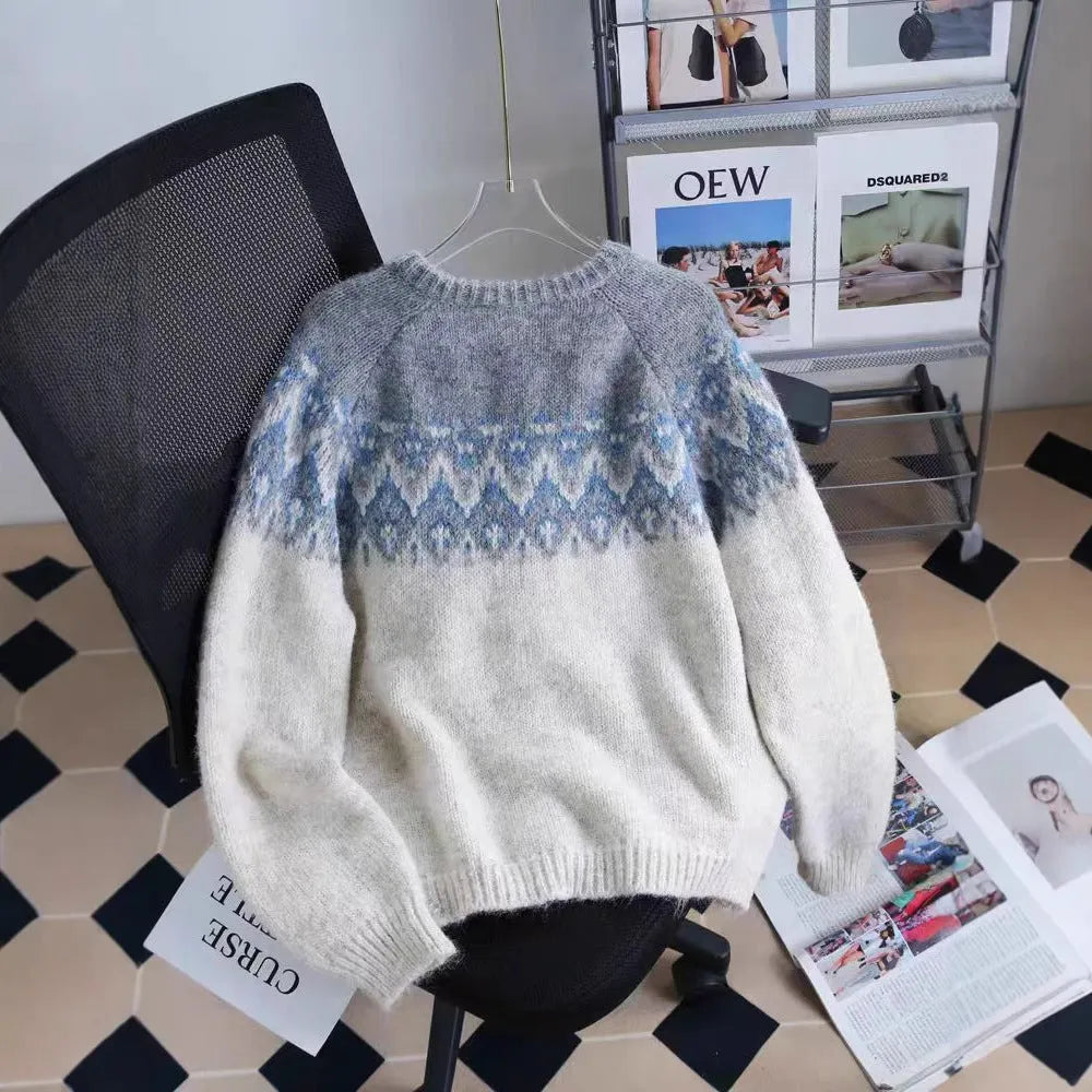 Women's beige jacquard knit sweater coat with contrast pattern, shown with long sleeves and a loose fit.
