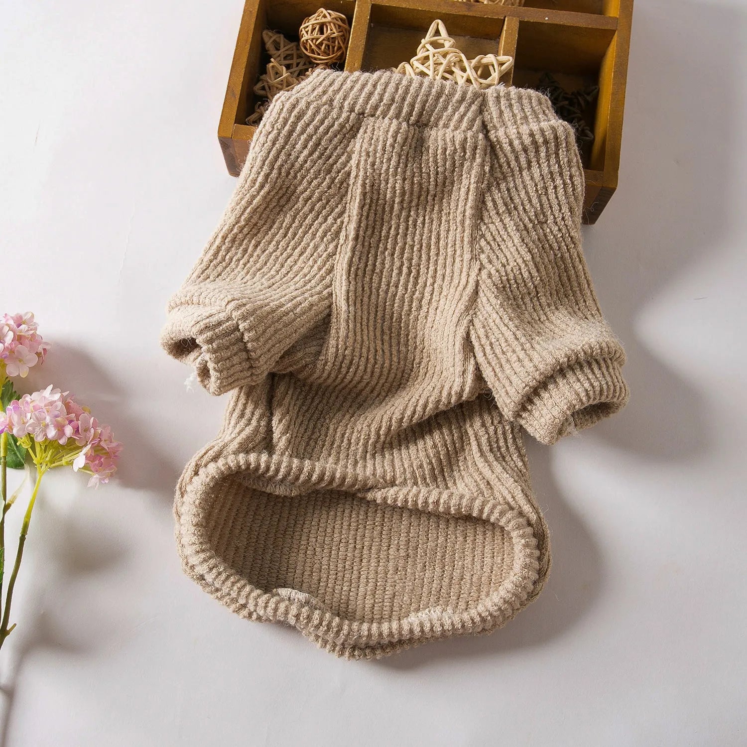 Brown cloth pullover sweater for small breed dog on model showing size fit