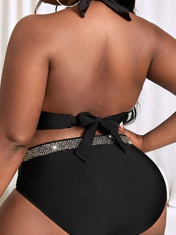 Black plus size women's bikini swimsuit with sleeveless bra and shorts on a mannequin.