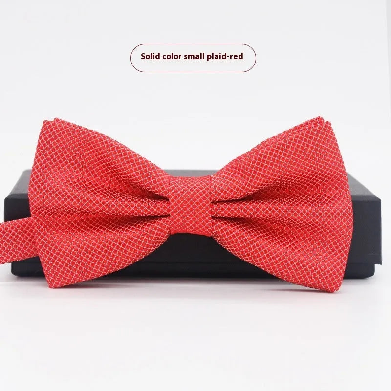 Men's flat head style polyester bow tie in a solid colour, shown with adjustable neck strap.