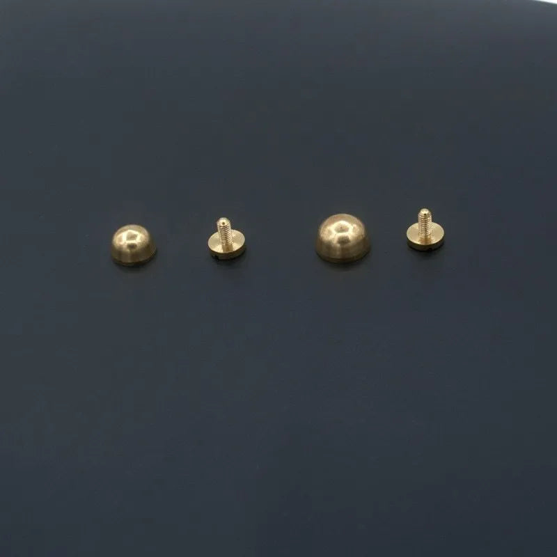Brass decorative foot nail buckles in round and bucket shapes, sizes 10x6mm and 12x7mm.