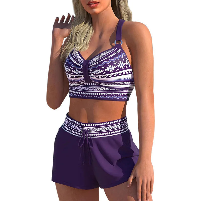 Women's navy blue and print two-piece bikini swimsuit made from polyester.