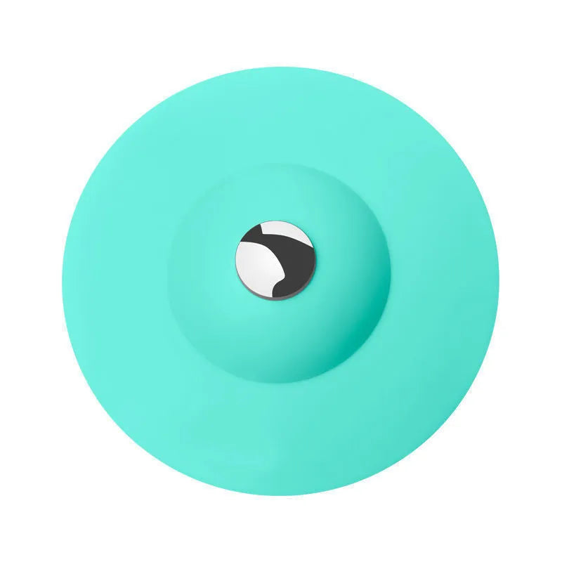UFO-style silicone press sink drain cover in white on a modern kitchen sink