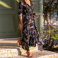 Women's long sleeve V-neck chiffon dress with A-line skirt and printed pattern.