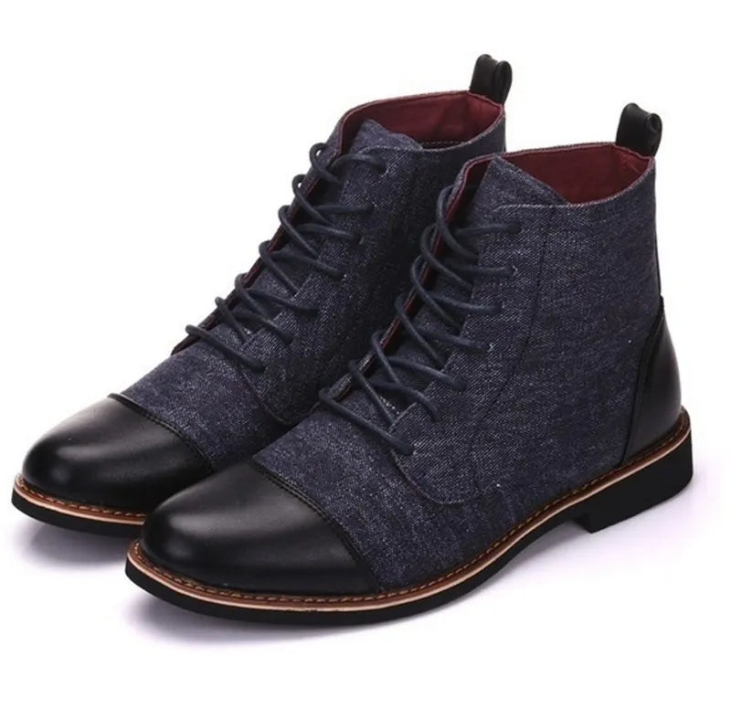 Men's black leather motorcycle boots with a silver buckle detail on a rubber sole.