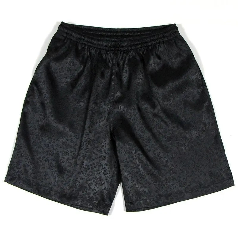 Men's black Tai Chi shorts with an elastic drawstring waistband on a white background.