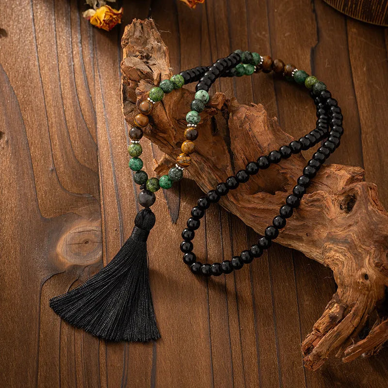 Vintage bohemian style natural stone bead necklace and bracelet set showing geometric round beads and tassel detailing