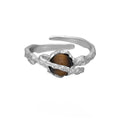 Adjustable opening Saturn ring in white gold colour tone on silver material