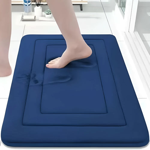 Thickened memory foam anti-slip coral velvet bathroom mat in grey placed at bathroom entrance