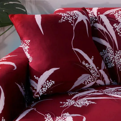Geometric patterned stretch sofa slipcover fitted on a modern two-seater sofa.