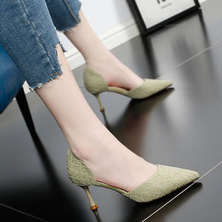 Women's black pointed toe stiletto high heels with a leather upper and thin heel.