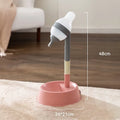 Green adjustable height pet water dispenser with separate bowl and stable base on kitchen floor