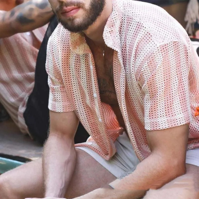 Men's pink loose-fit cardigan with a waffle texture and unique hole design detail.