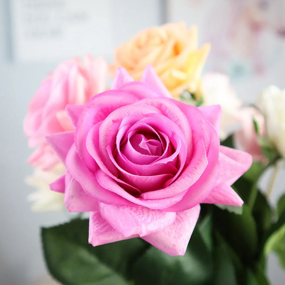 Silk fabric artificial rose bouquet in assorted colours with realistic petals, approximately 42cm long
