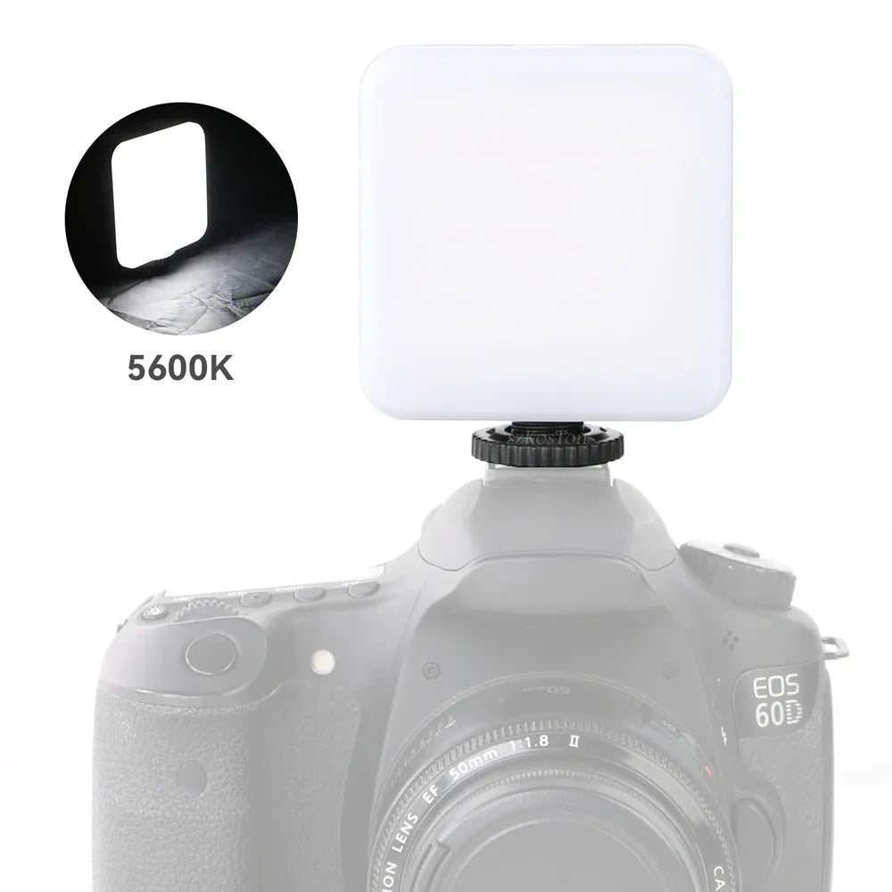 Mini square outdoor camera flash on a small tripod with a rotatable head