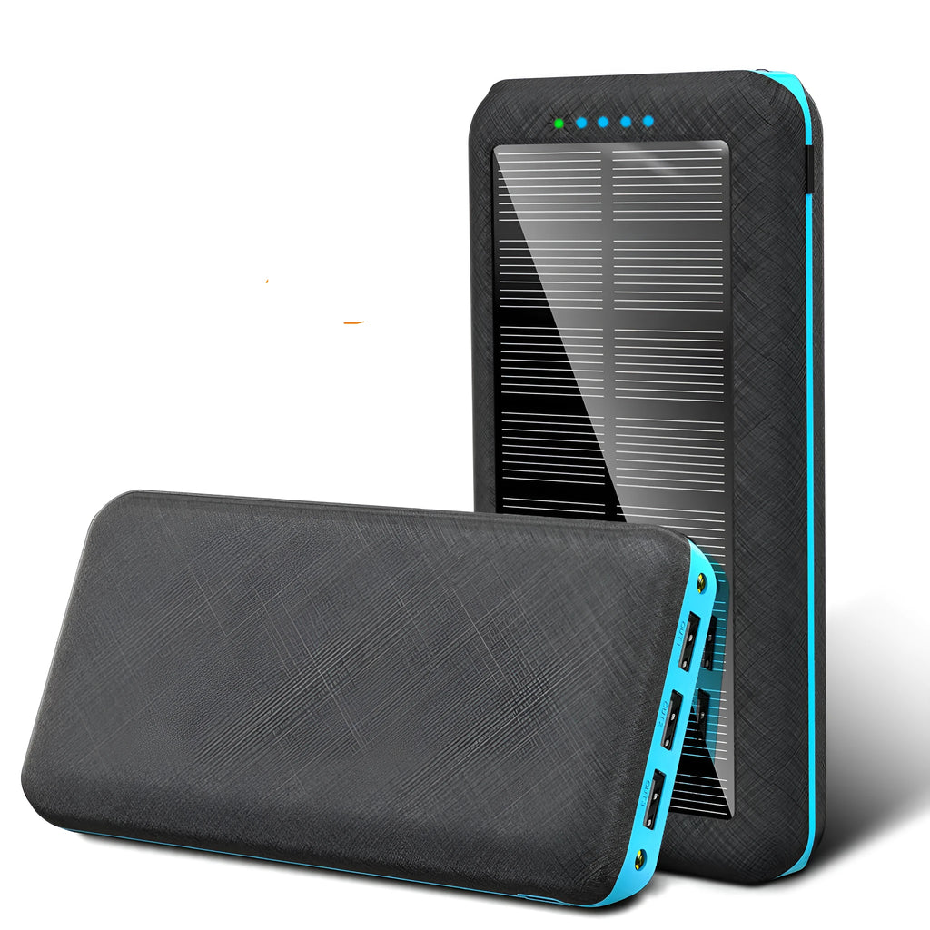 Portable power bank with wireless charging pad and three USB ports in black plastic casing
