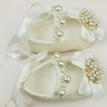 Milky white handmade soft sole cloth princess shoes with pearl detailing and lace-up closure for babies