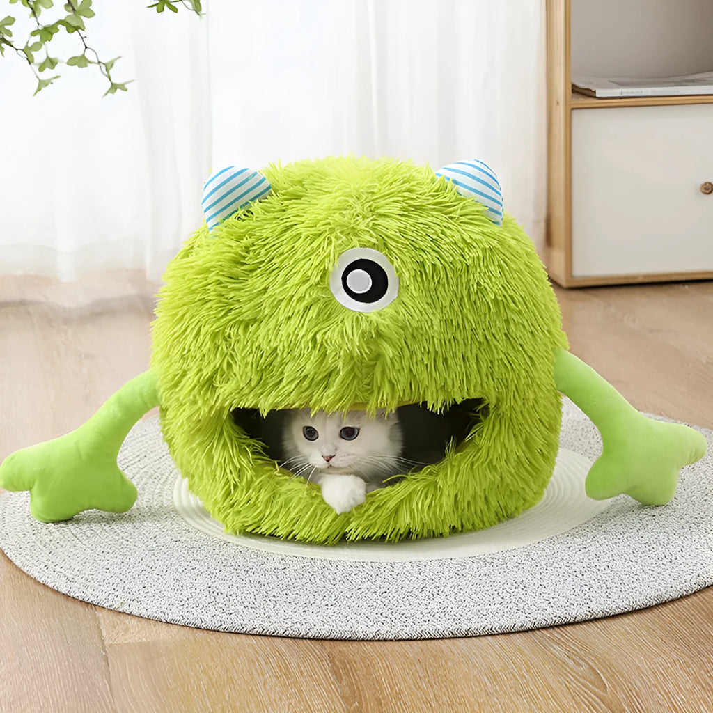 A round fluffy plush pet bed for cats and small dogs on a wooden floor.