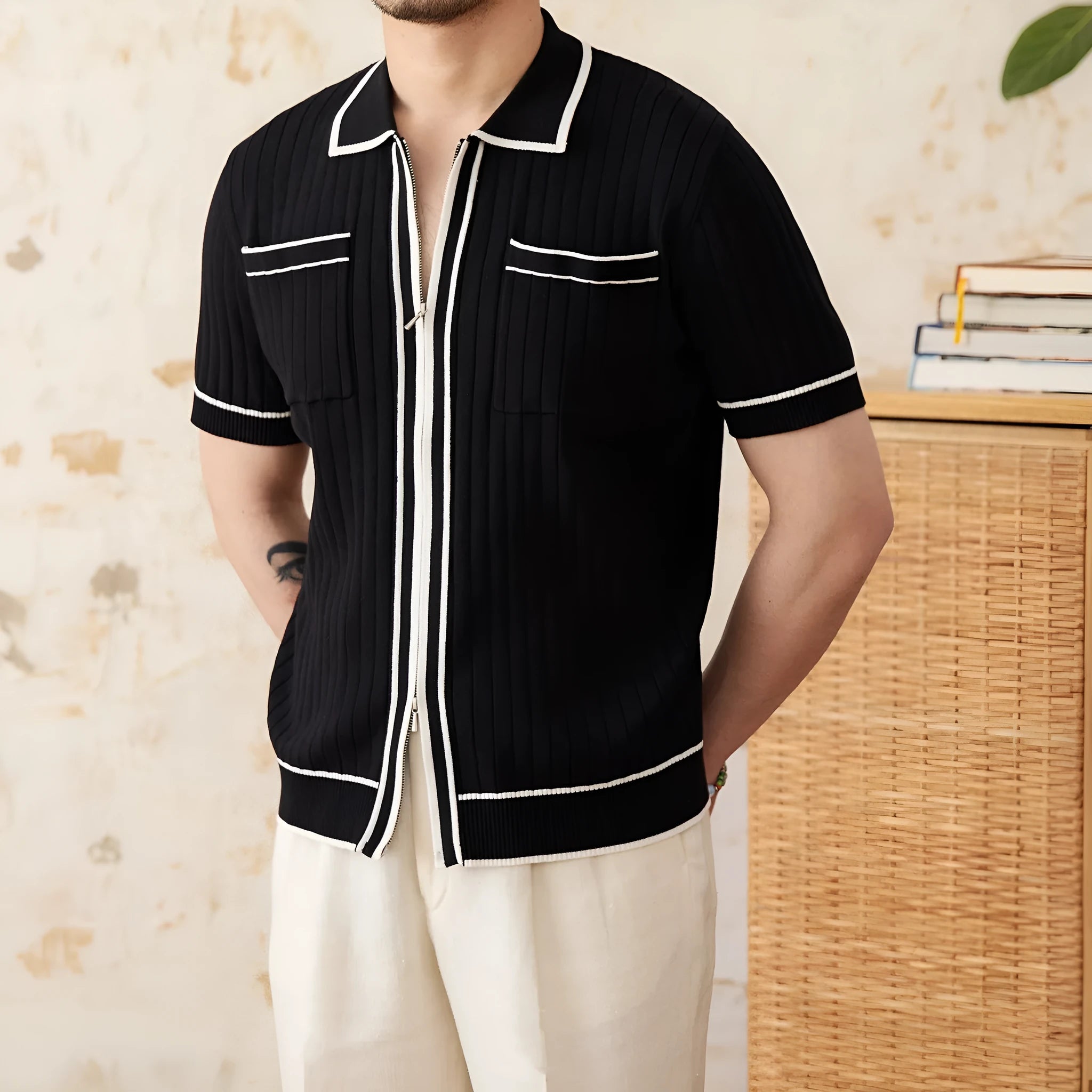 Men's slim-fit black lapel polo shirt with short sleeves made from elastic viscose blend knit fabric.