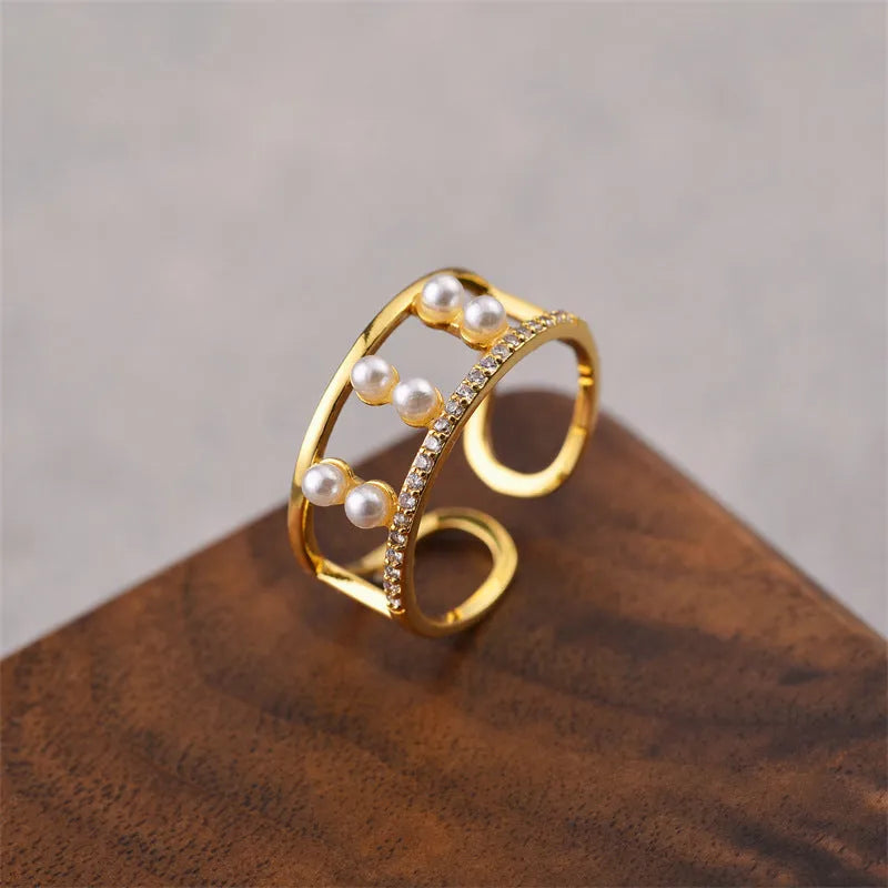 Gold geometric open fashion ring made from electroplated copper, shown in a Korean-inspired style.