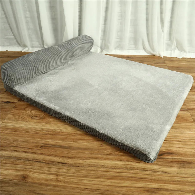 Corduroy bolster dog bed with non-slip base in grey, showing S M L XL size comparison.